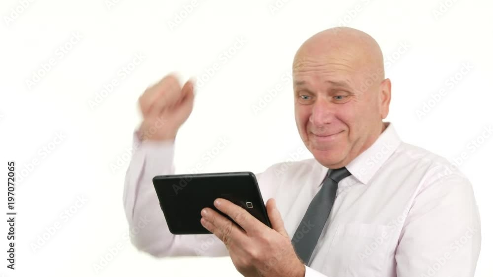 Businessman Use Tablet and Read Good News Gesturing Happy Businessman Use Tablet and Read Good News Gesturing Happy