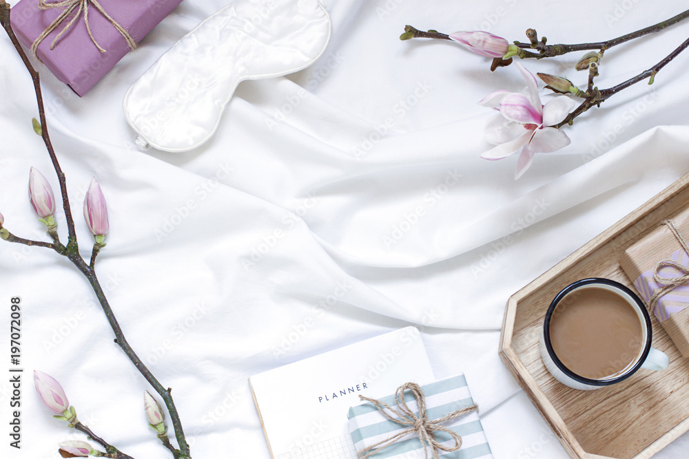 Magnolia flower flat lay morning in bed concept composition. Top view Magnolia flower flat lay morning in bed concept composition. Top view
