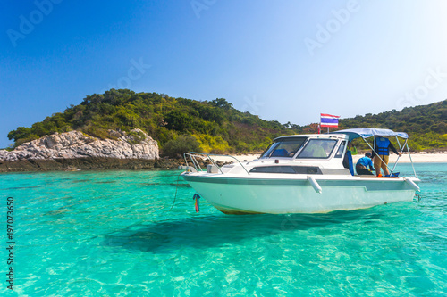 Yacht in the sea around the island on a background of blue sky , Thailand, Copy space.