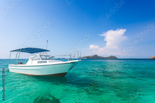 Yacht in the sea around the island on a background of blue sky , Thailand, Copy space.