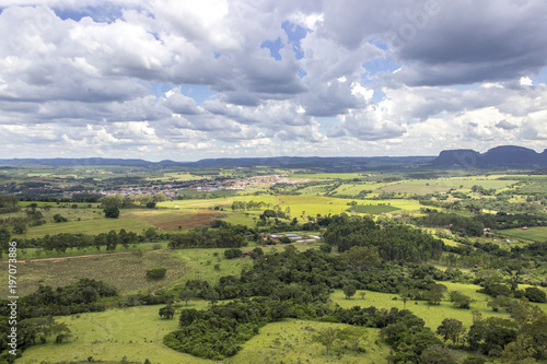 Fototapeta Naklejka Na Ścianę i Meble -  Beautiful mountainous landscape in the interior of Brazil. Some farms, a small town and some plantations are visible