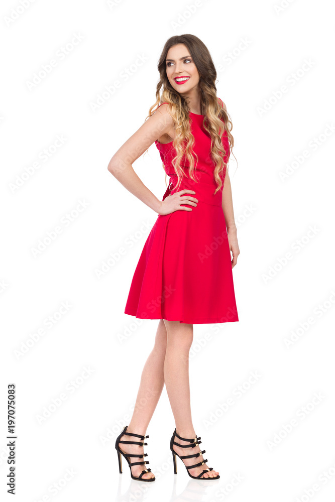 Smiling Woman In Red Dress Is Looking Over Shoulder
