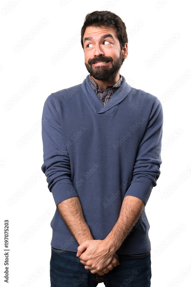Handsome brunette man with beard making unimportant gesture on white background Handsome brunette man with beard making unimportant gesture on white background