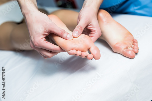 Leg massage treatment in the spa salon, A woman receiving a holistic massage treatment. © F8  \ Suport Ukraine
