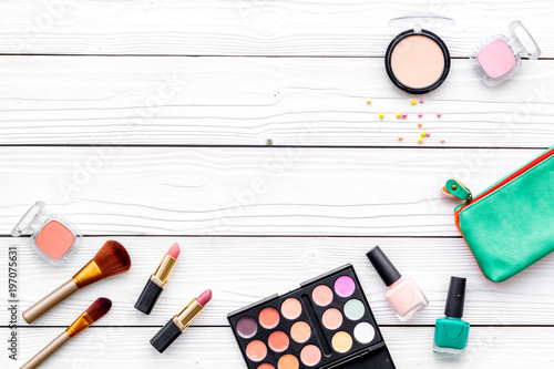 Decorative cosmetics for make up on white desk background top view mockup