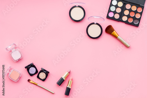 Beauty set with decorative cosmetics. eyeshadow palette, brushes on pink background top view mockup
