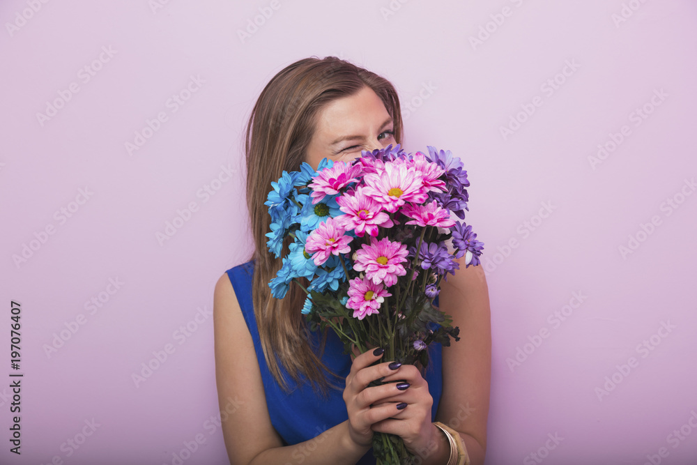 Charming pretty woman holding bouquet of flower. Spring, flower concept. Happy woman's day.