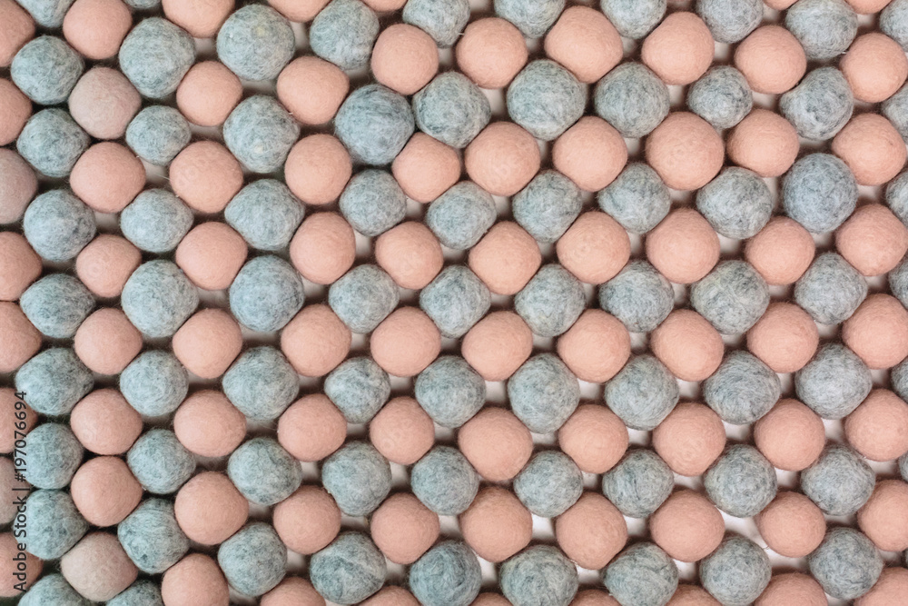 Fototapeta premium Background of merino wool balls.A lot of pink and gray balls.