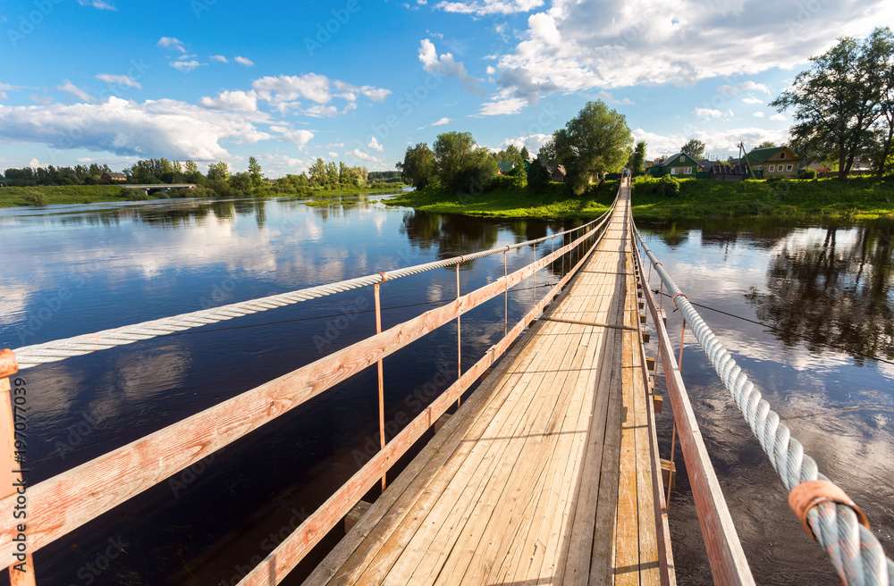Suspension bridge across the Msta river in Borovichi, Russia