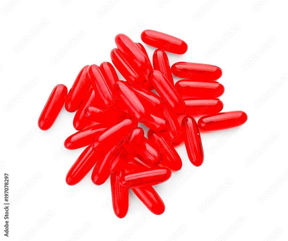 Transparent red pills on white background Transparent red pills on white background
