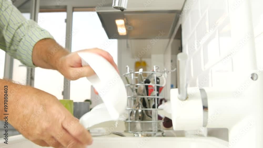 Man Hands Wash Plates in Sink with Faucet Water Jet Kitchener Job Dishes Washer Man Hands Wash Plates in Sink with Faucet Water Jet Kitchener Job Dishes Washer