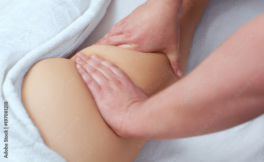The masseur makes Anti-cellulite massage on the buttock and thighs of the patient. Treatment of excess weight. The masseur makes Anti-cellulite massage on the buttock and thighs of the patient. Treatment of excess weight.