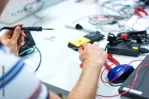 Electrician soldering wires.