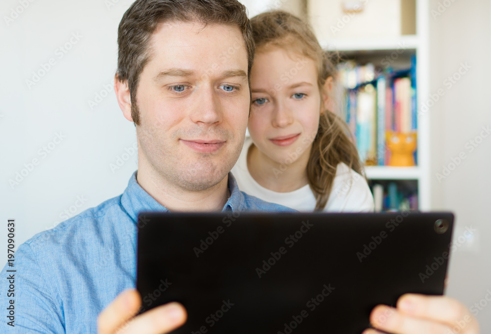 Father and his daughter using tablet pc. Father and his daughter using tablet pc.