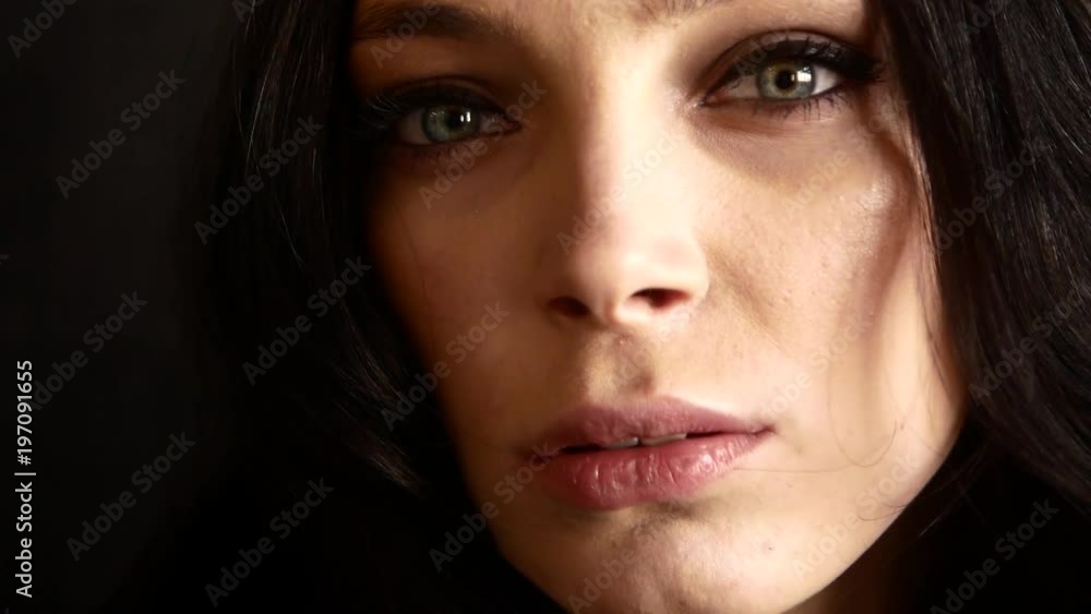 A beautiful video portrait of a spectacular girl. The girl looks seductively into the camera A beautiful video portrait of a spectacular girl. The girl looks seductively into the camera