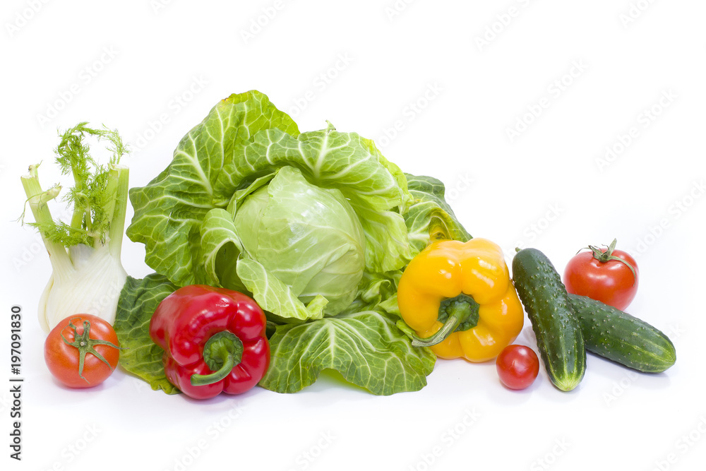 Green cabbage. Yellow pepper. Red tomatoes and cucumbers on a white background. Green cabbage. Yellow pepper. Red tomatoes and cucumbers on a white background.