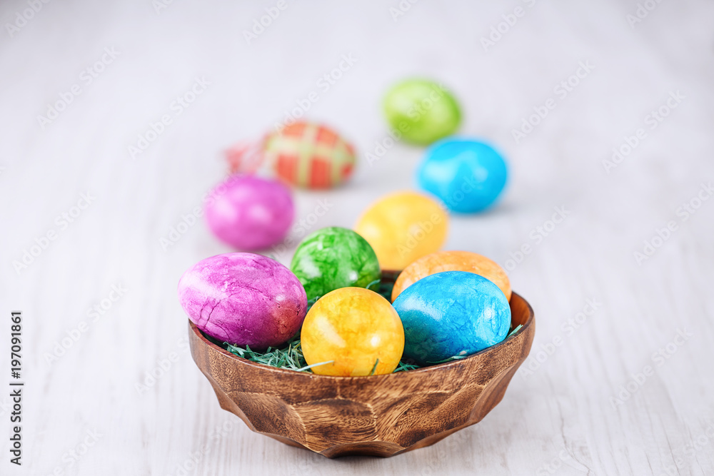 easter eggs in bowl on a wooden background easter eggs in bowl on a wooden background