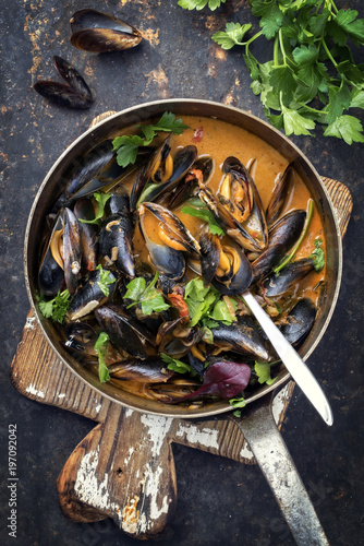 Traditional French blue mussel in bouillabaisse as top view in a casserole