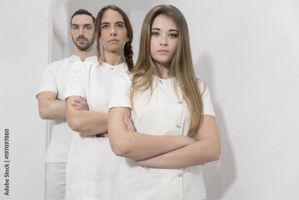 Portrait of confident happy group of doctors standing at the medical office Portrait of confident happy group of doctors standing at the medical office