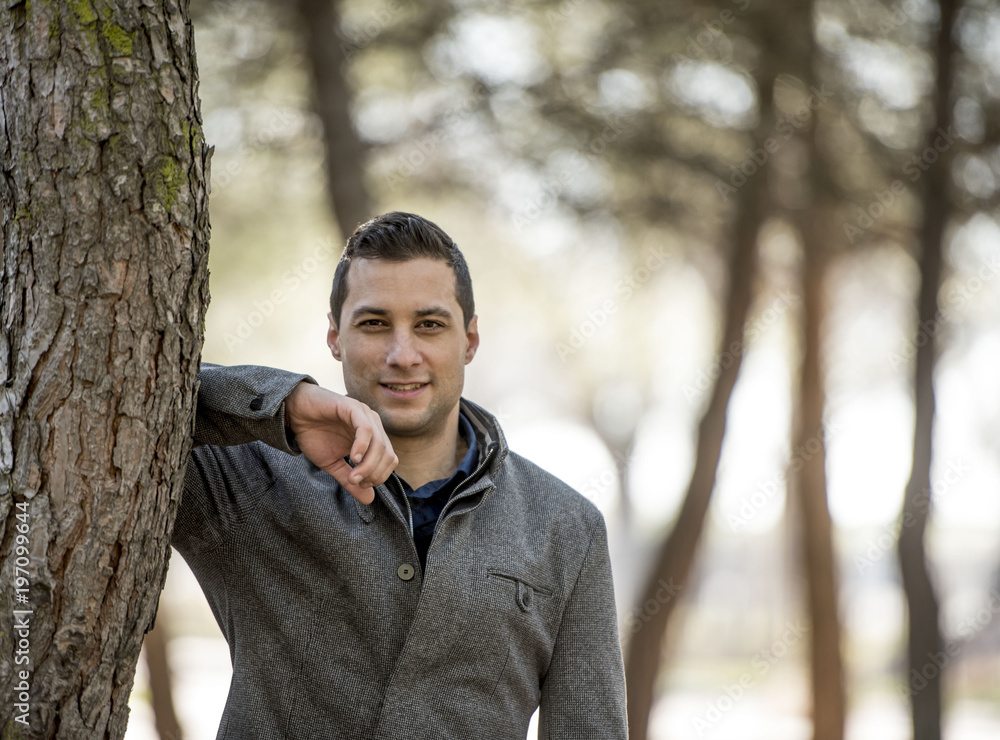 Male model posing in the park Male model posing in the park
