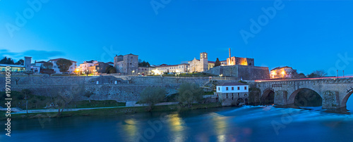Panorama at night landscape of the city of Barcelos, district Braga, Portugal. Landscape on the river Cávado, Barcelos bridge, Paço dos Condes, water mill and church. Buildings all in stone and old wi photo