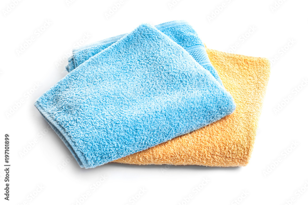 Folded clean terry towels on white background Folded clean terry towels on white background