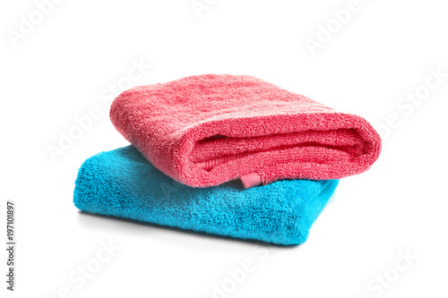 Folded clean terry towels on white background