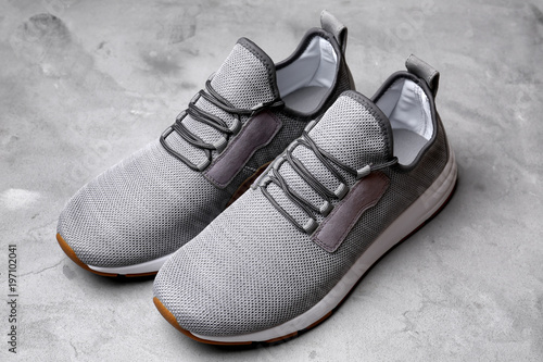 Stylish male shoes on grey background
