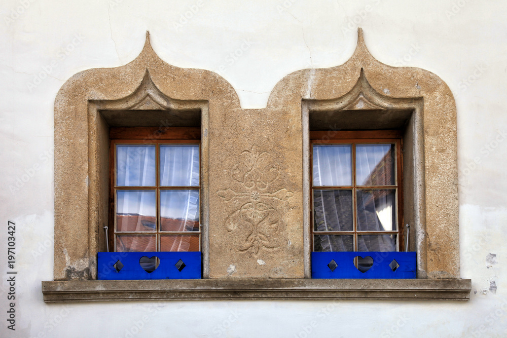 stone decorated windows on old house, Switzerland