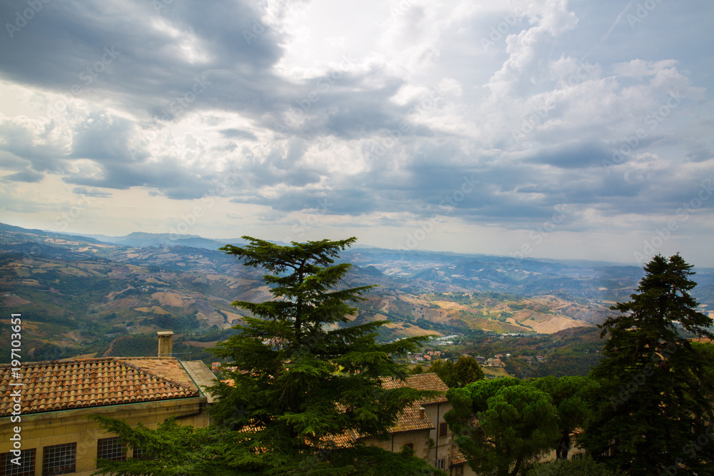 San Marino top view. Beautiful panoram of San Marino. Dark heavy sky, Italy. San Marino top view. Beautiful panoram of San Marino. Dark heavy sky, Italy.