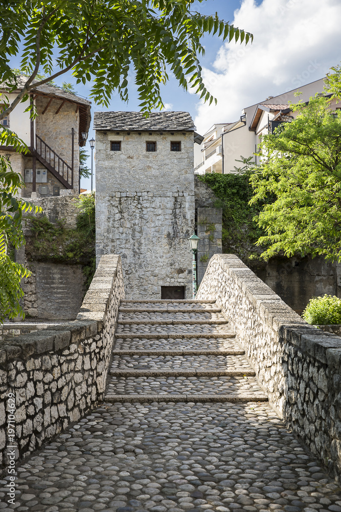 Stone stairs of an old arch bridge in Unesco area of old town Mostar, Bosnia and Herzegovina