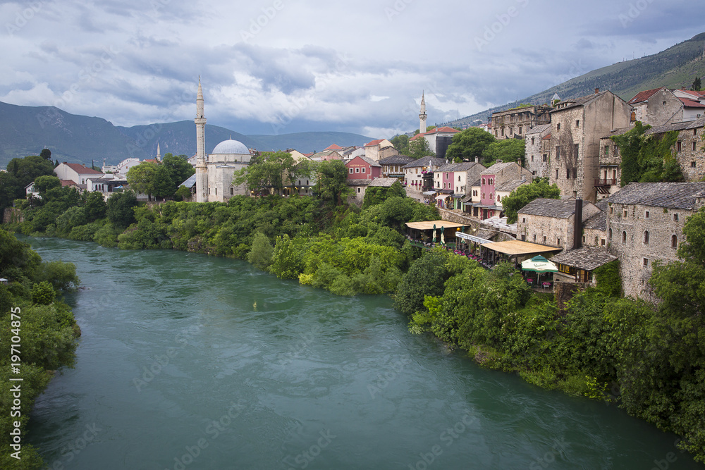 Old town, Koski Mehmed Pasa mosque and Neretva River, Mostar, Bosnia and Herzegovina. The old town was destroyed during the Croat-Bosniak war in 1993