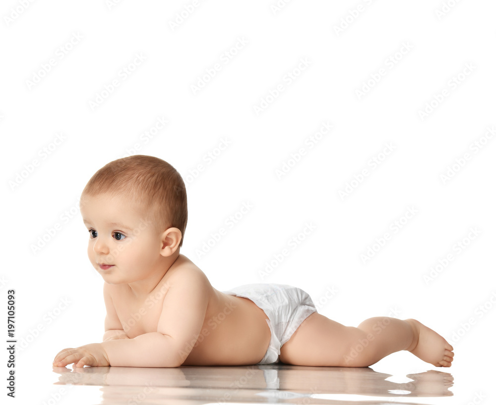 8 month infant child baby boyl toddler lying naked looking at the corner 