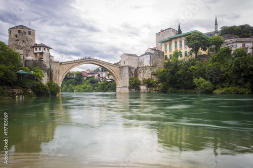 View of the single-arch Old Bridge or Stari Most Neretva over River in Mostar, Bosnia and Herzegovina. The Old Bridge was destroyed in 1993 by Croat military forces during the Croat–Bosniak War. © Melanie