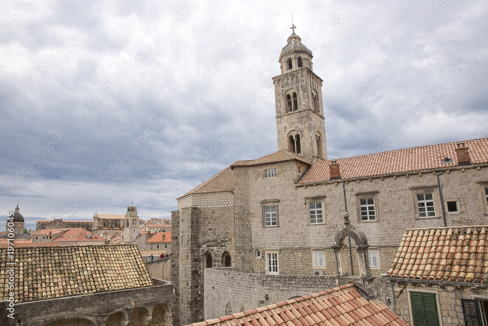 Saint Dominic Church bell tower and red roofs of old buildings in old town Dubrovnik, Croatia