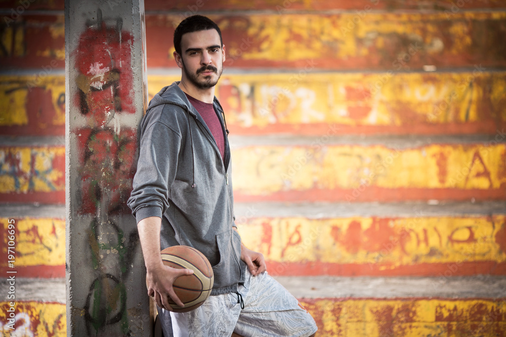 Male basketball player standing Male basketball player standing
