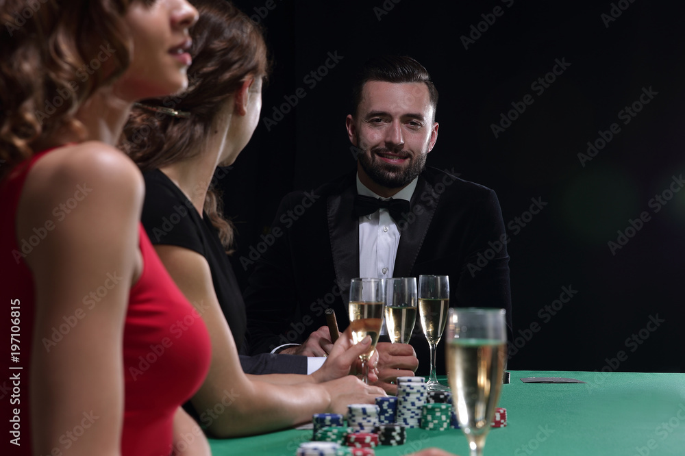 brunette girl in the casino playing poker brunette girl in the casino playing poker