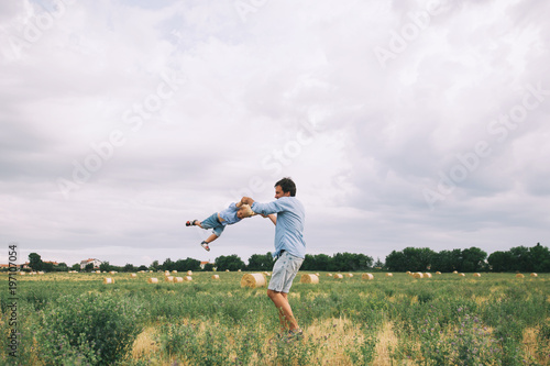 Happy father and son. Family outdoors together