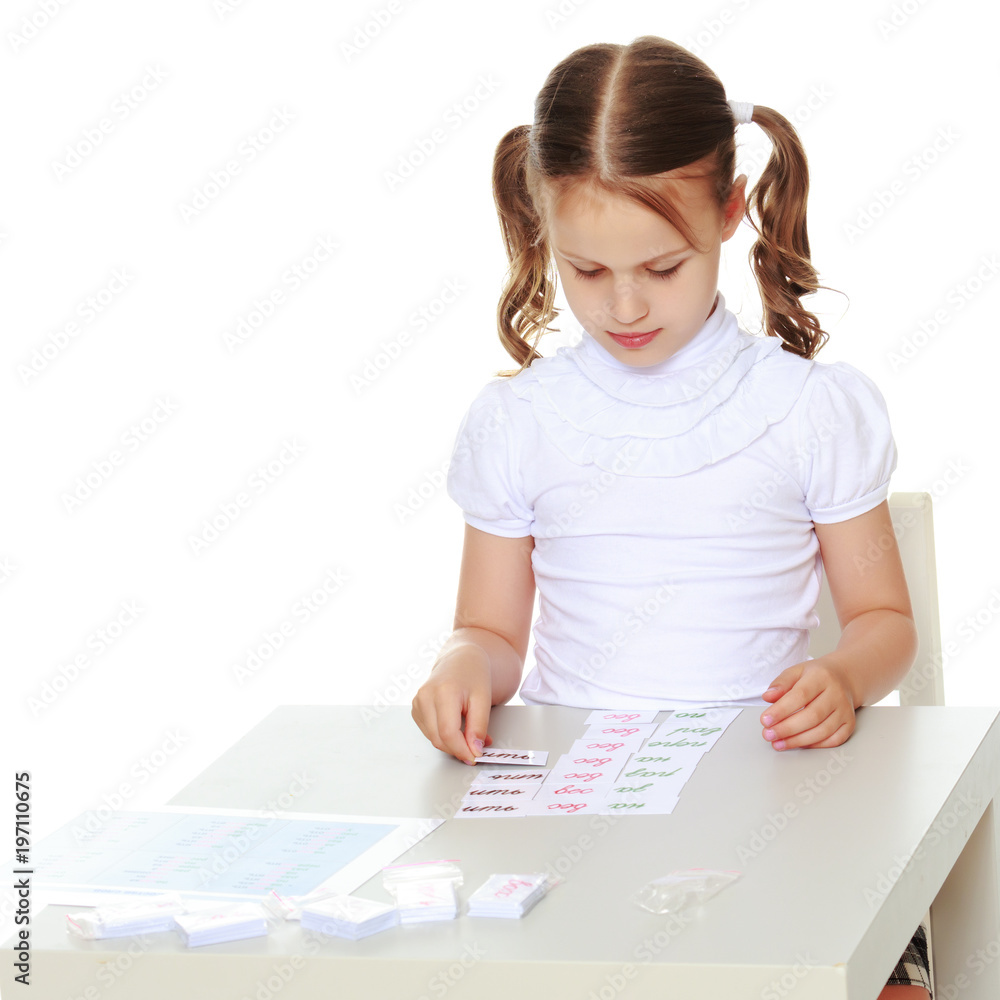 A little girl is studying Montessori stuff. A little girl is studying Montessori stuff.