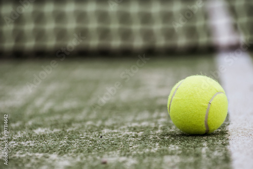 ball tennis on track with network and space for text © charlymorlock