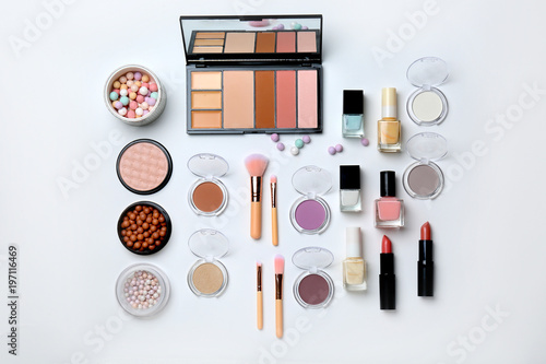 Decorative makeup products on white background