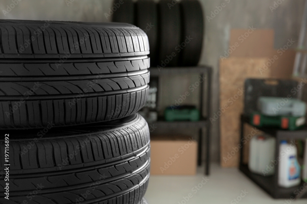 Obraz premium Car tires in automobile service center, closeup