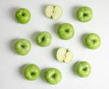 Fresh green apples on white background, flat lay
