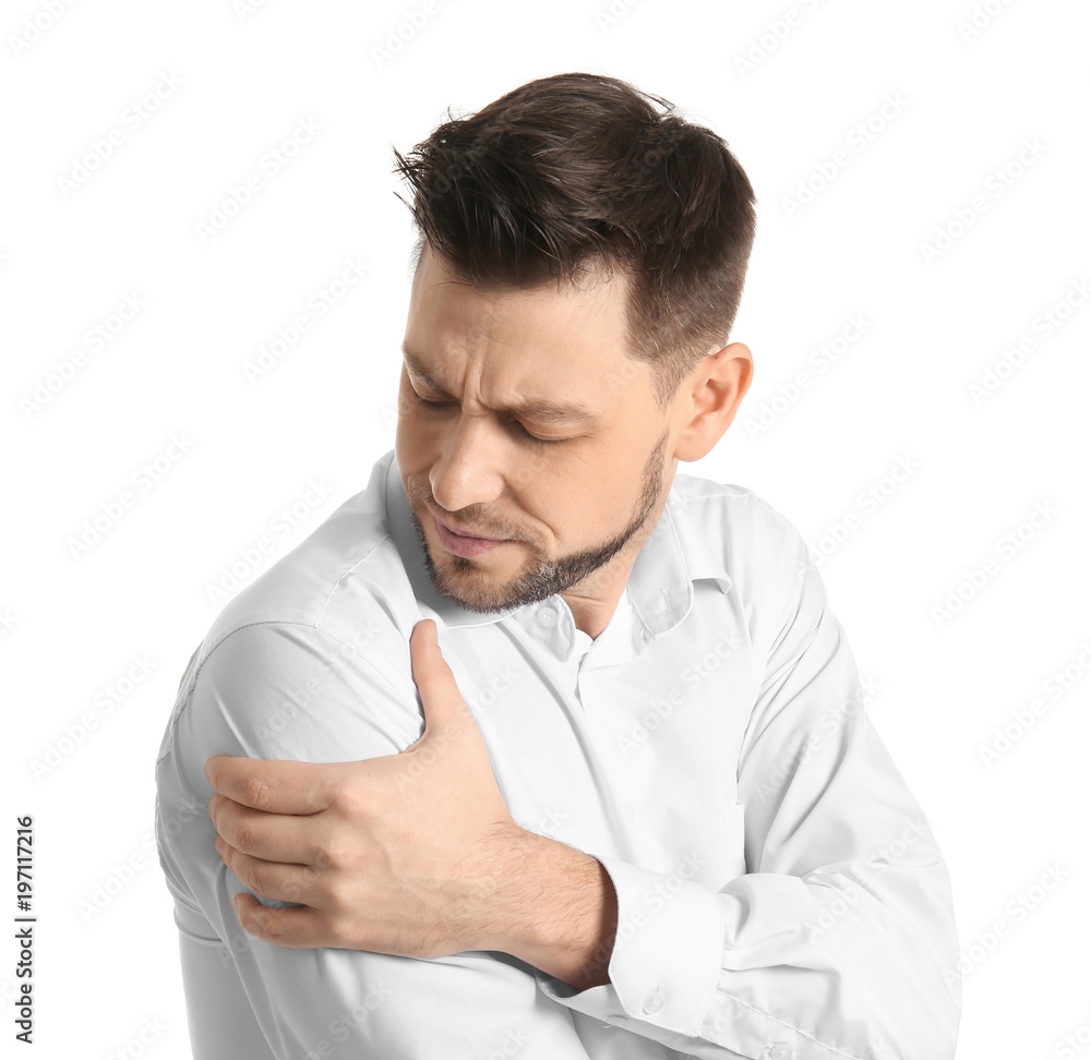 Young man suffering from shoulder pain on white background Young man suffering from shoulder pain on white background