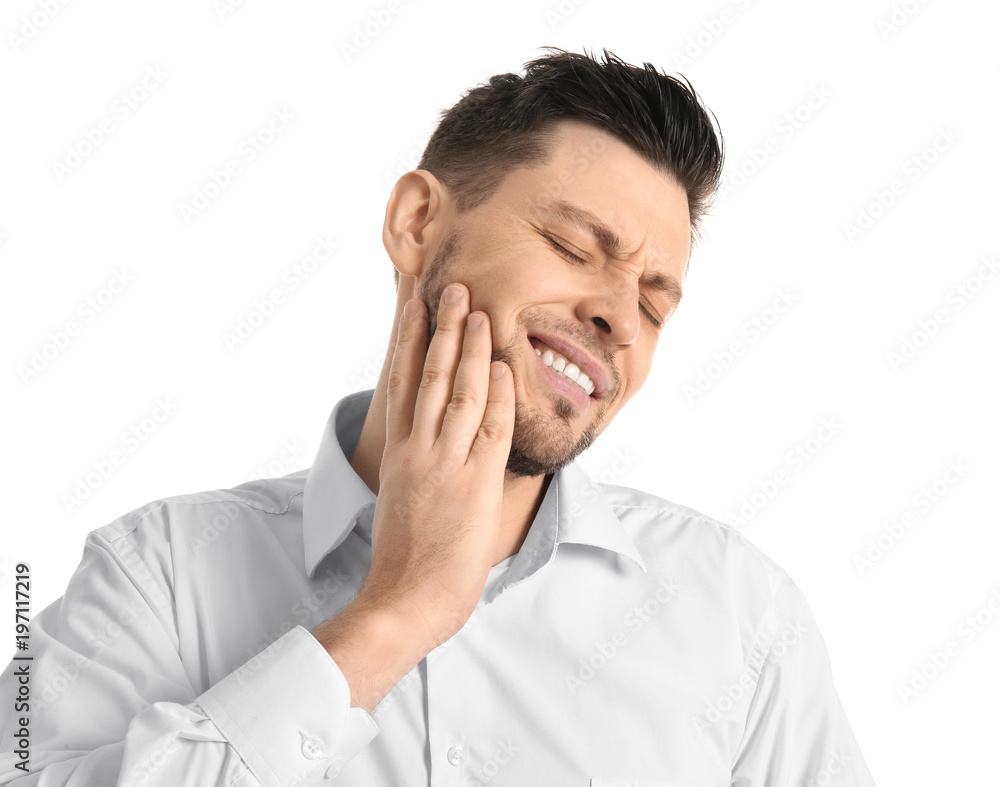 Young man suffering from toothache on white background Young man suffering from toothache on white background