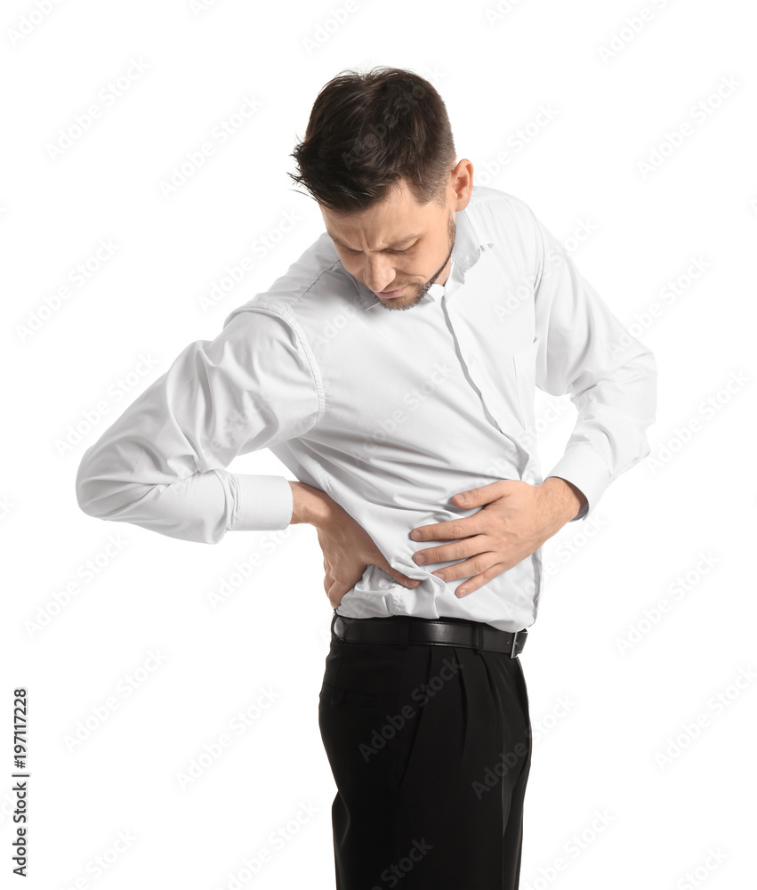 Young man suffering from back pain on white background Young man suffering from back pain on white background