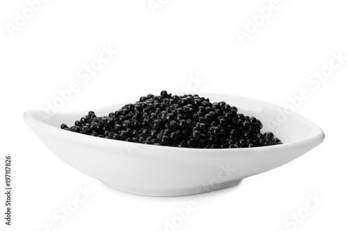 Ceramic bowl with black caviar on white background