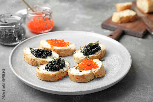 Sandwiches with black and red caviar on plate