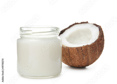 Beautiful composition with coconut oil and nuts on white background