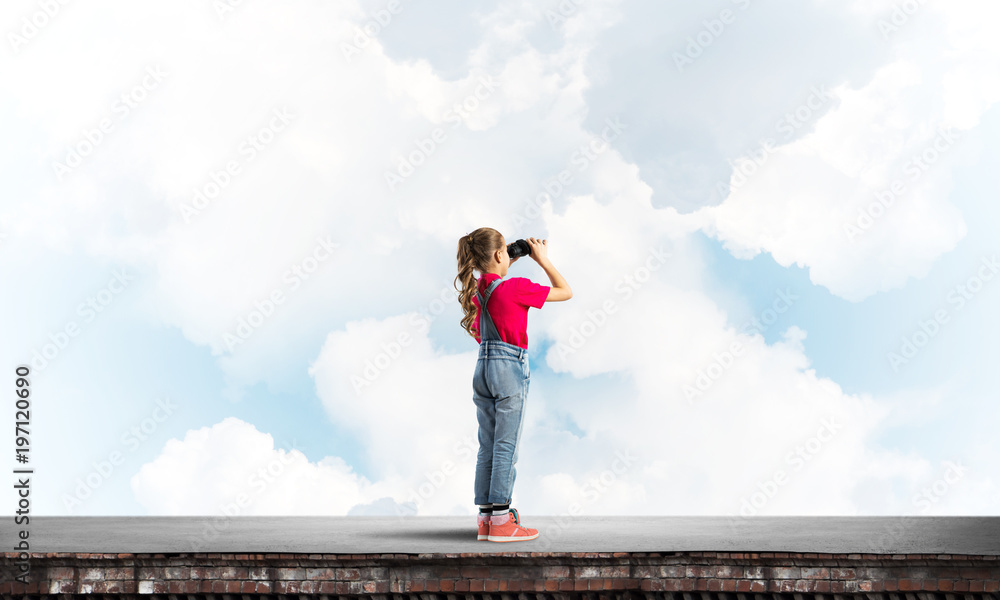 Concept of careless happy childhood with girl of school age looking in future Concept of careless happy childhood with girl of school age looking in future